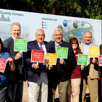 Mary (M.C.) Niland stands with members of CWI leadership and Boise Mayor Dave Bieter at the recently acquired property located a