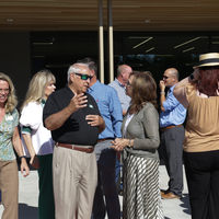 People talking outside at an event