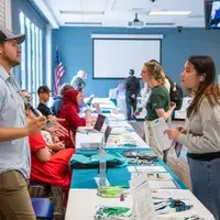 Staff members working with student
