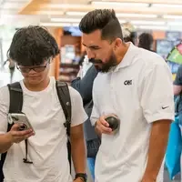 Staff helping a student