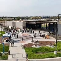 Crowd gathered outside the Simplot Agriculture Building at College of Western Idaho during an outdoor event.