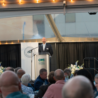 Speaker standing at podium