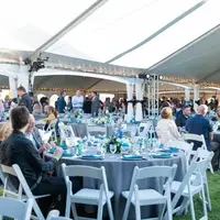 Guests sitting and filling their tables at event