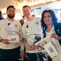 Nursing students smiling and holding CWI swag bags