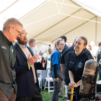 Fire Service Technology student showcasing equipment