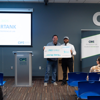 Grand prize winner with giant check