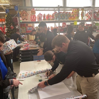 People wrapping packages