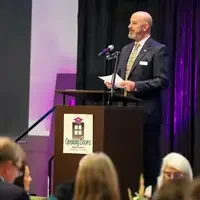 Mike Pena standing at the podium