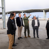 CWI employees checking out air force jet