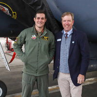 Jones with military member posing for picture