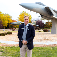 President Gordon Jones in front of a jet