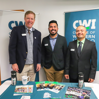 President Gordon Jones, Damian Valle, Luis Caloca standing for a picture