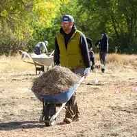 Instructor planting at Restoration Week