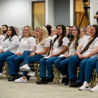 Students listing at Pinning Ceremony