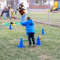 CWI students working with children full obstacle course