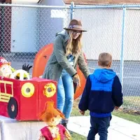 CWI students working with children ar spider web toss