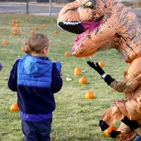 CWI students working with children pumpkin hunt