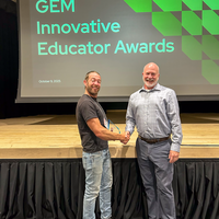 Sean Gould and Greg Wilson shaking hands