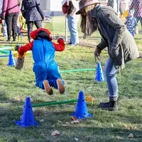 CWI students working with children jumping over cones