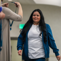 Student walking up to pinning