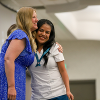 Faculty and student celebrating 