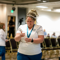 Graduate holding candle