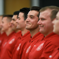 Fire student listening to ceremony speakers