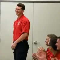 Student laughing at graduation ceremony