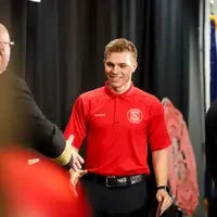 Student walking across stage at graduation
