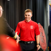 Student walking across stage at graduation