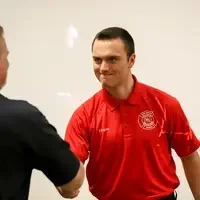 Student shaking hands at celerbration