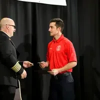 Fire student accepting certificate of completion