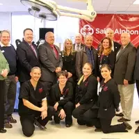 Saint Alphonsus Regional Medical Center and CWI representatives in classroom.