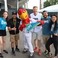 President Jones and members of CWI's Enrollment Team with Humphrey the Hawk
