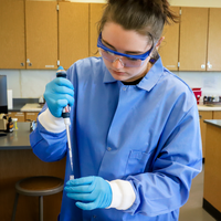 INBRE Scholar using equipment in lab
