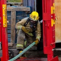 Student holding a hose