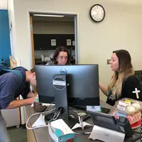 Tutoring working alongside students