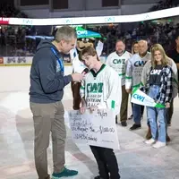 Logan White talking into the microphone