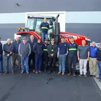 Donated tractor with students, staff and leadership