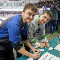 Students filling out drawing