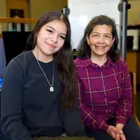 Ruby Araujo and Teresa Tafia de Yensen sitting in Tutoring Center