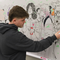 Chereji working on his mural