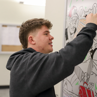 Chereji touching up his mural 