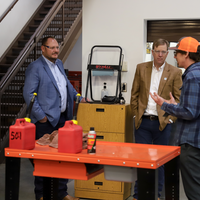 Tour group learning more about Powersports