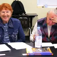 Students challenge their skills by filling out crossword puzzles using common words they will regularly use.