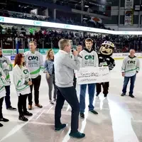 Benjamin Johnson being interviewed on ice with check