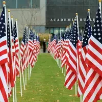 Multiple american flags in a ling on CWI lawn