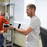 Sinsel demonstrating how the Universal Sprinkler Fitting works