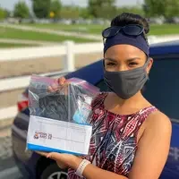 A #mightyCWI student holding a Be Safe, Be Mighty kit distributed on campus the first week of classes