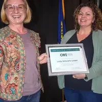 Winners hold their certificates at a faculty professional development event.
